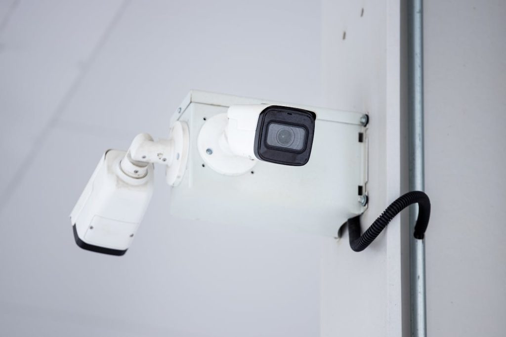 Crafting Captivating Headlines: Your awesome post title goes here A close-up shot of a modern, mounted surveillance camera highlighting security and surveillance.